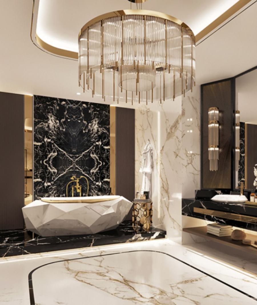 Bathtub with organic shape and a white marble design vanity with gold finishes.