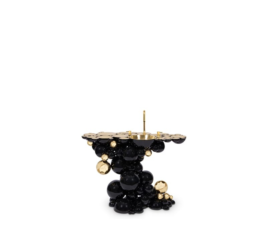 Bathroom ideas with a washbasin with a organic structure and  finished in a dramatic black lacquer and gold-plated accents