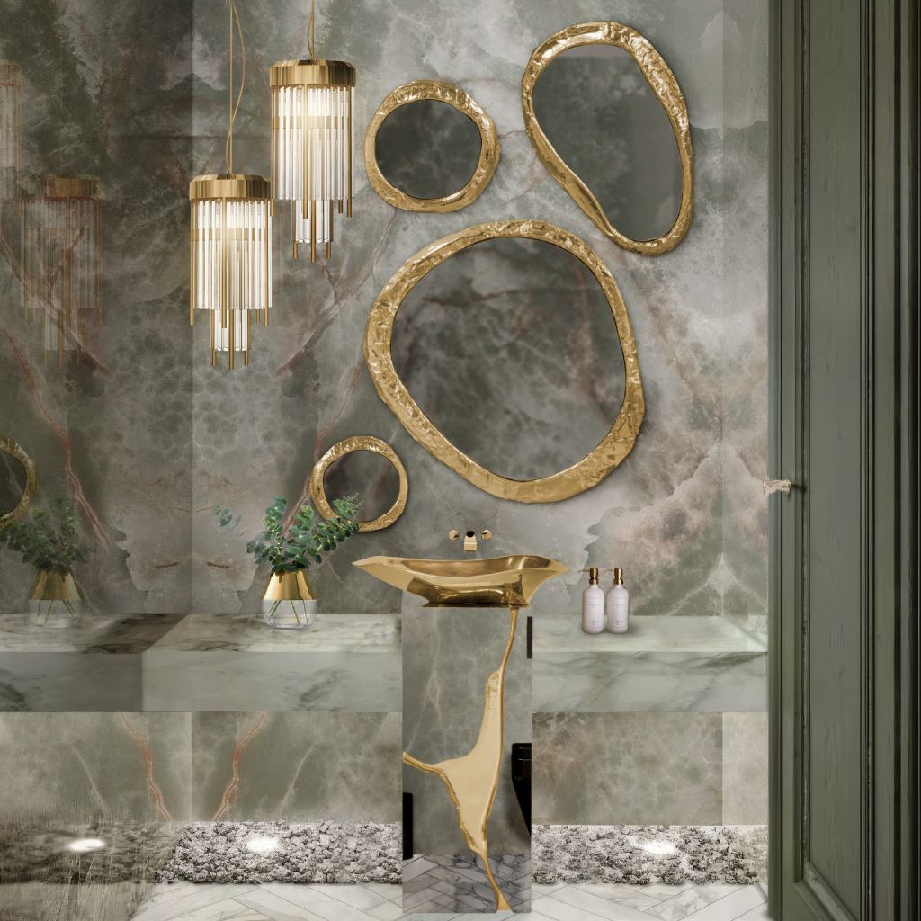 Luxury powder bathroom featuring veined green marble walls, Lapiaz Pedestal Sink as a sculptural centerpiece, Halo Mirror, and Pharo Pendant Lamp for a contemporary, opulent design.