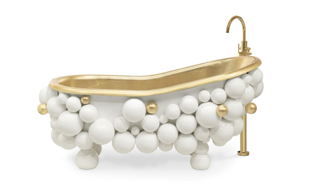 Luxury bathrooms featuring Newton Bathtub with curved lip, gold-painted fiberglass interior, and black and gold lacquered spheres, creating a sculptural and elegant centerpiece.